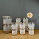 Vintage orangeade service in white granite glass and golden edging