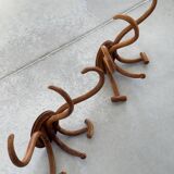 Pair of curved wooden coat racks or hooks from the 1900s
