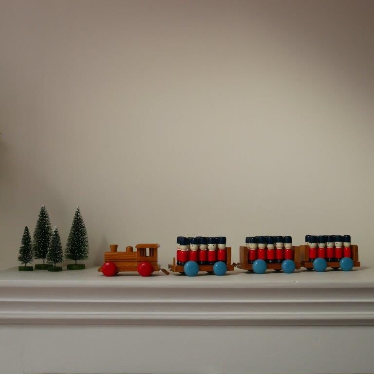 Wooden train with soldiers