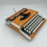 WE typewriter orange