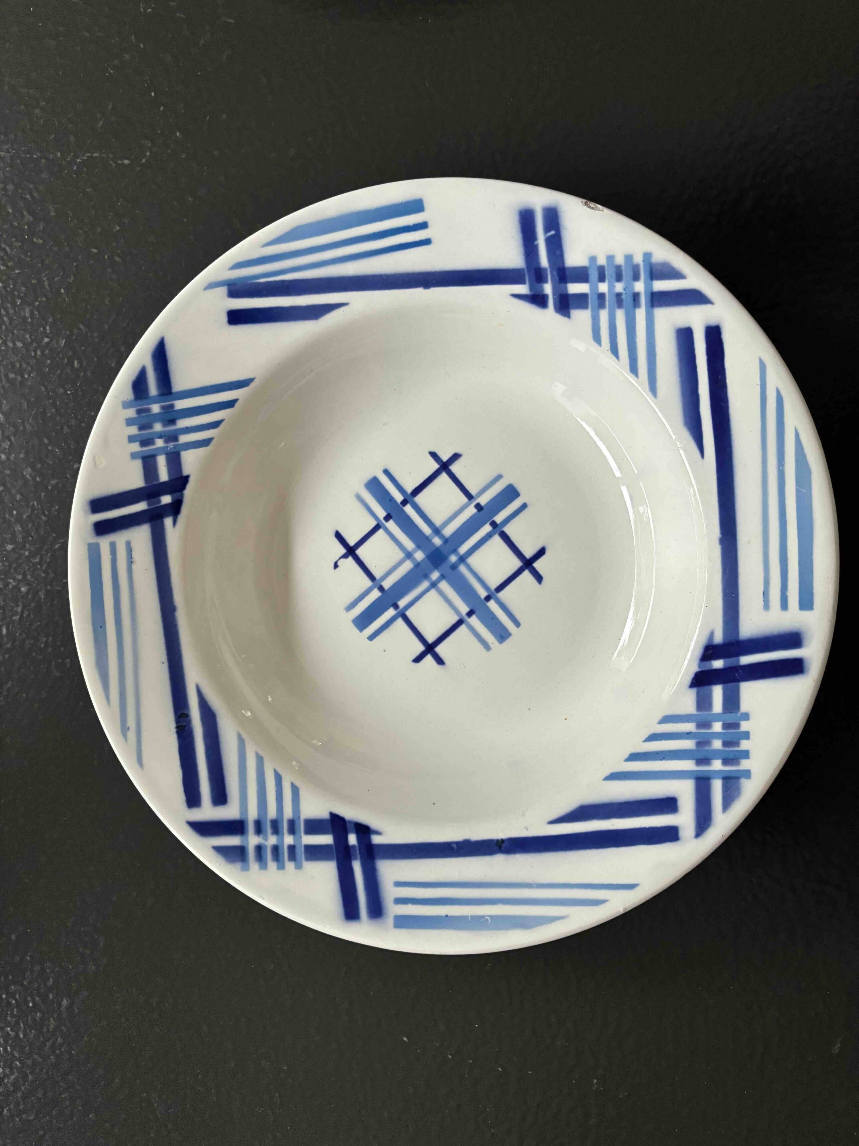 Set of 9 vintage deep plates with blue patterns.