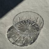 Circular glass ashtray with stylized petal patterns