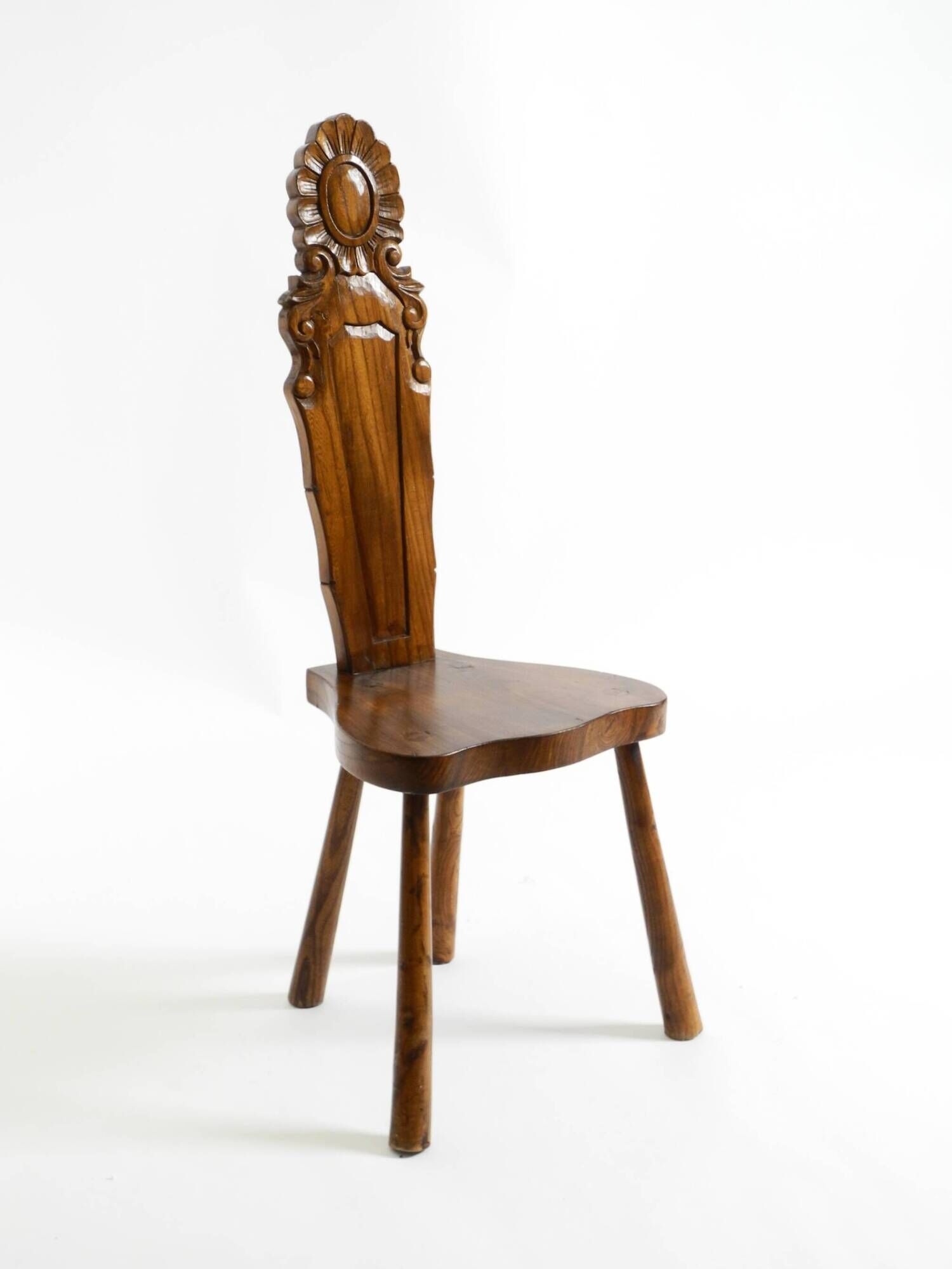 Solid wood chair with an ornate, hand-carved backrest – Made in Spain