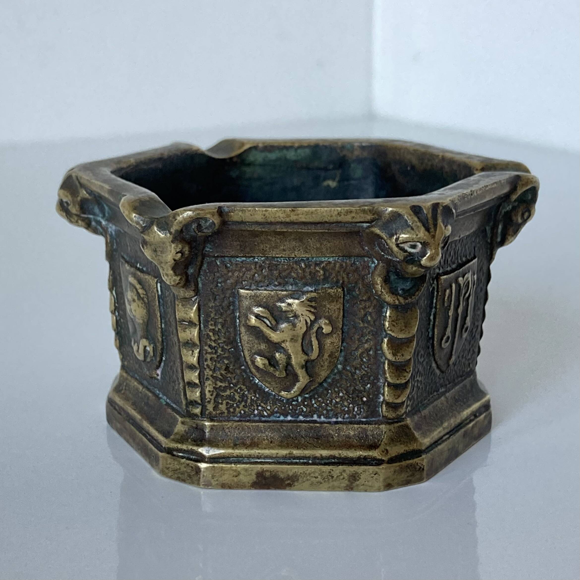 Gothic style bronze ashtray in the shape of a well with heraldic motifs by Max Le Verrier