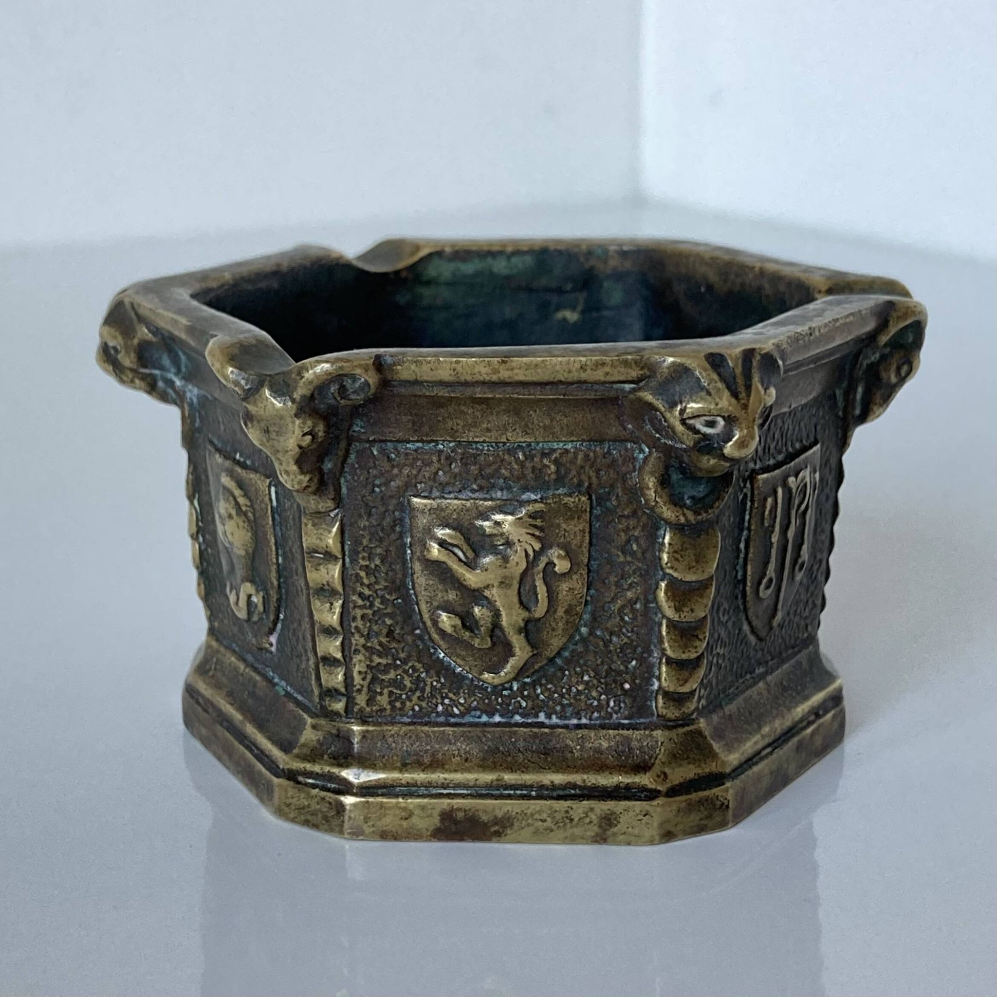 Gothic style bronze ashtray in the shape of a well with heraldic motifs by Max Le Verrier