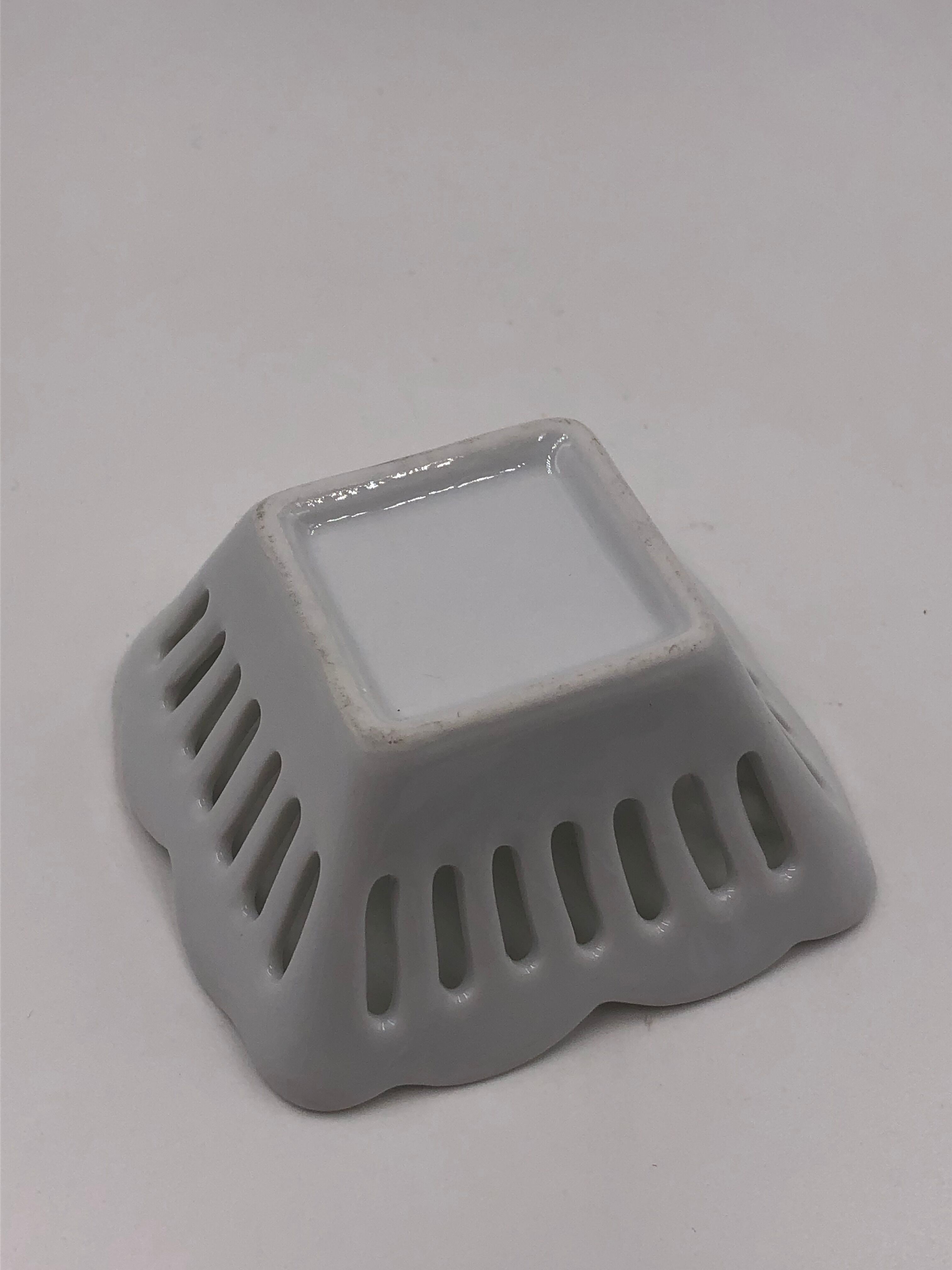 Empty vintage openwork porcelain pocket