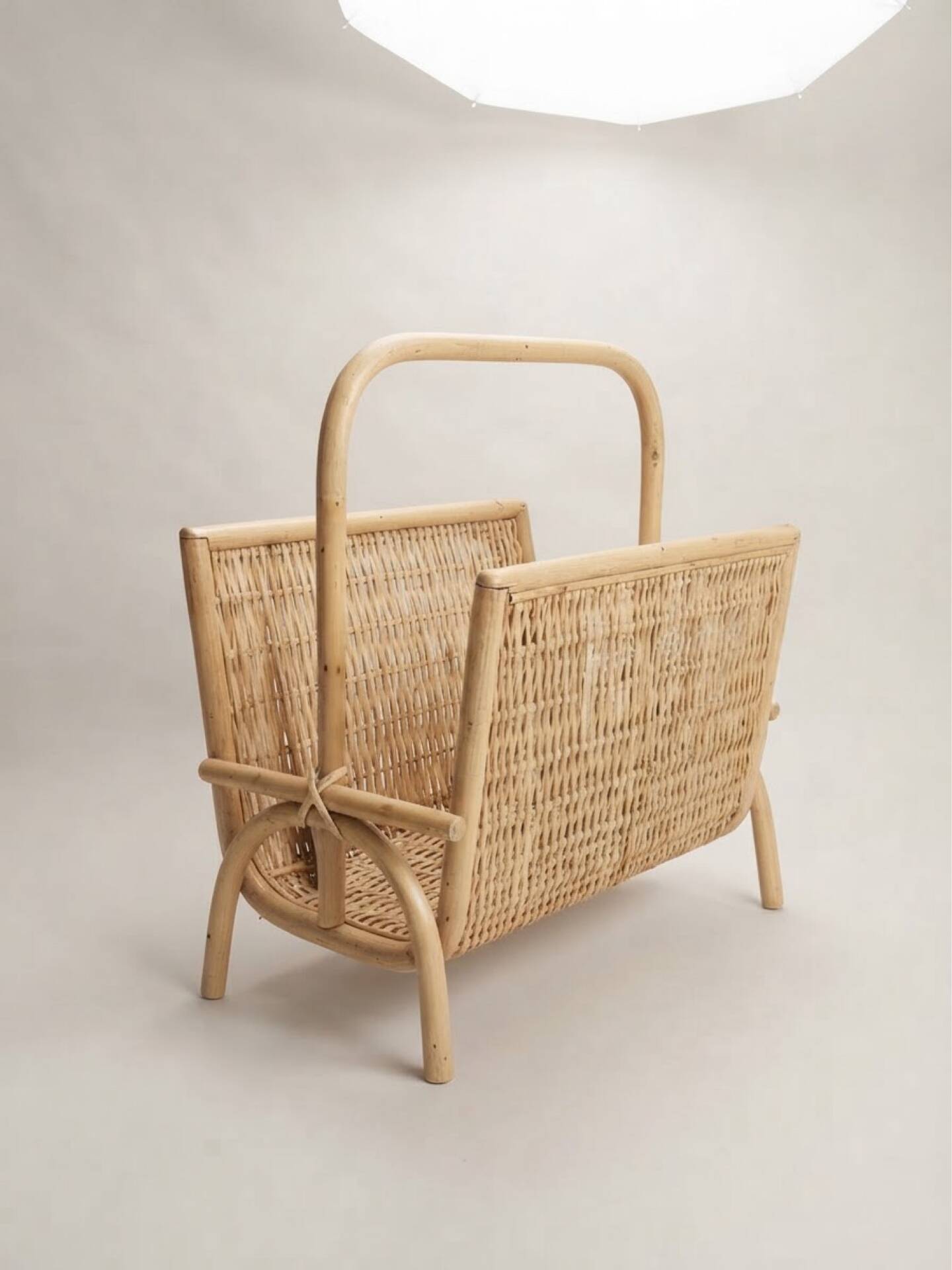 Vintage magazine rack in woven rattan and bamboo.
