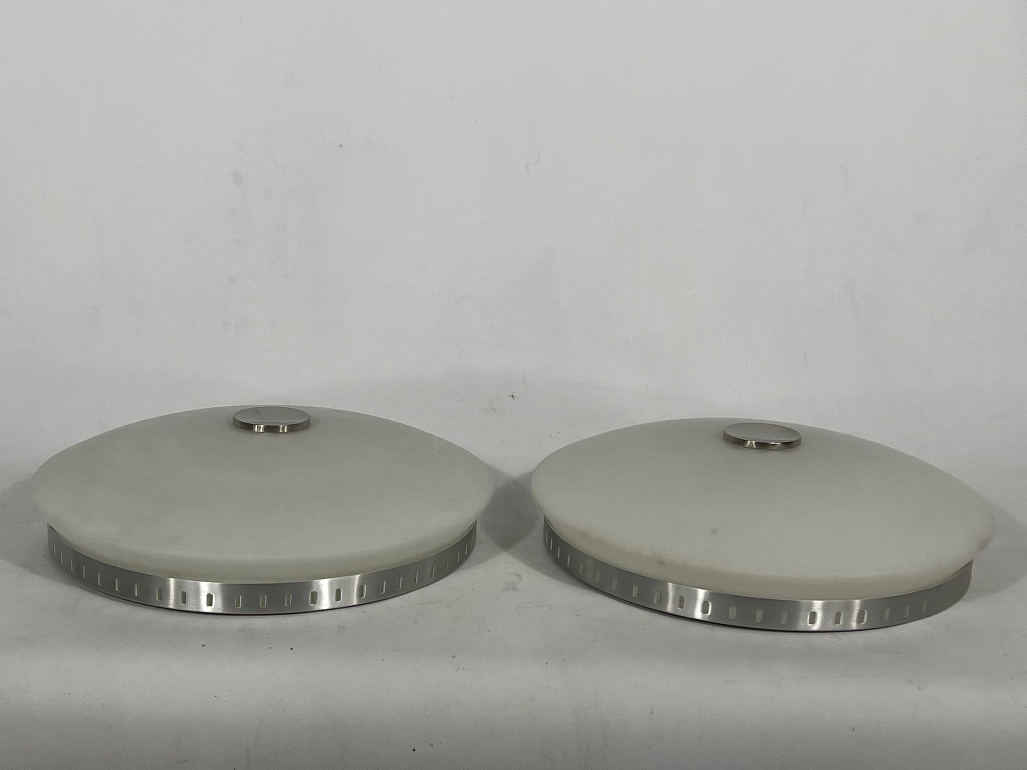 Stilux Milano, pair of round opaline glass ceiling lamps. 1960s