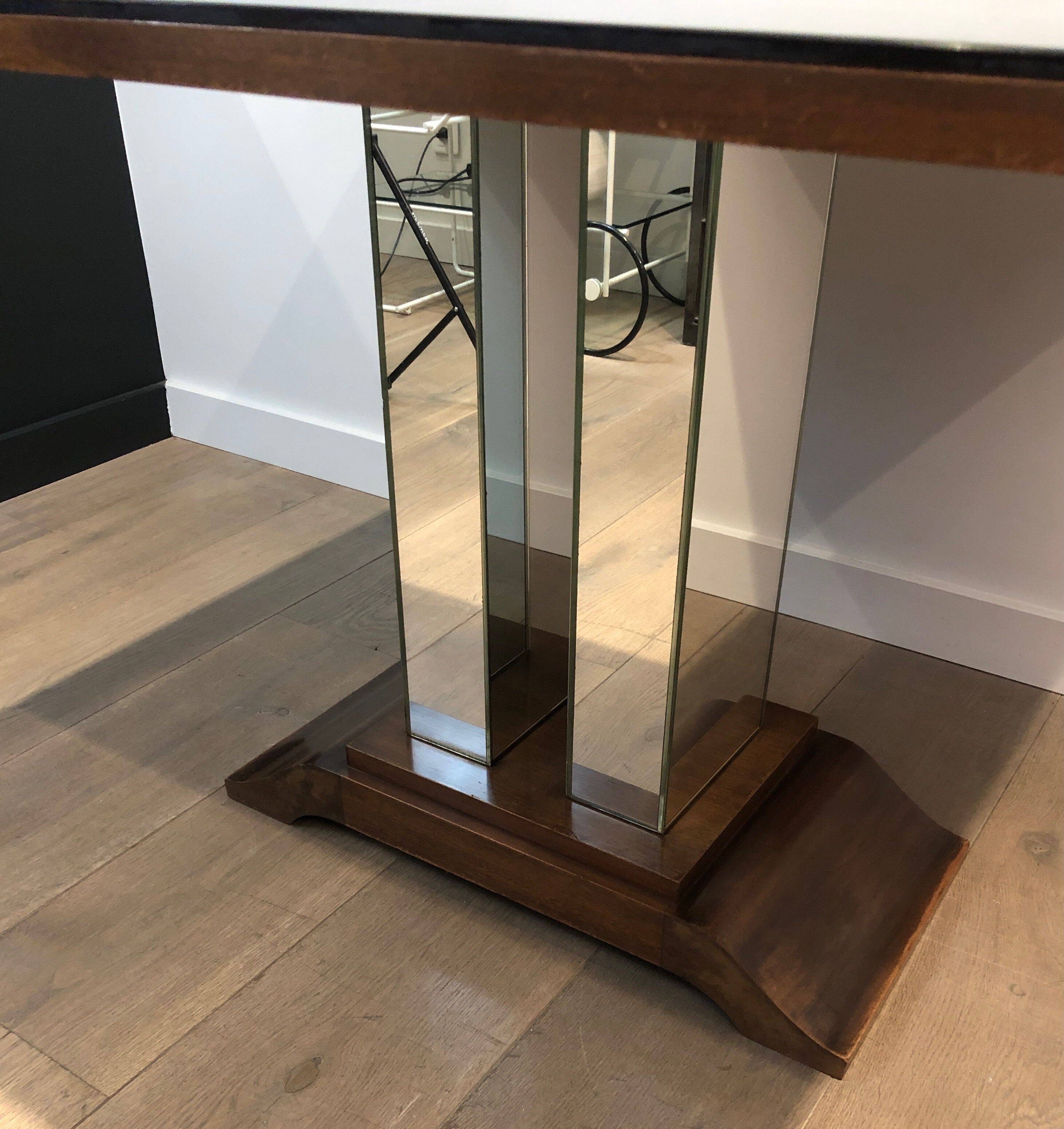Art Deco centre table with a mirrored eglomisé top in the style of Jules Leleu and Max Ingrand.