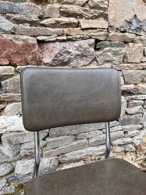 3 bronze-green faux leather chairs with chrome frames