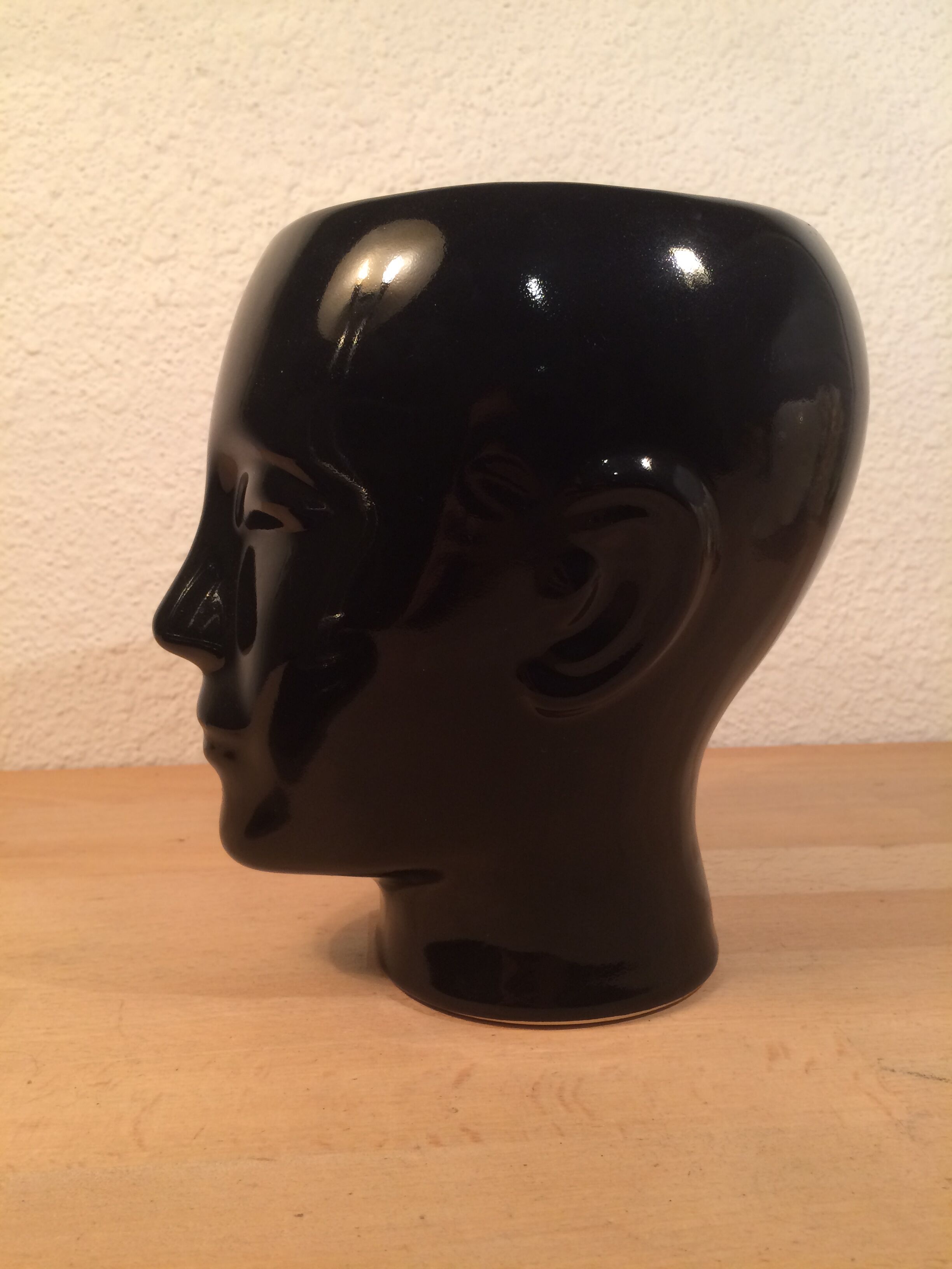 2 black and white ceramic head vases, face