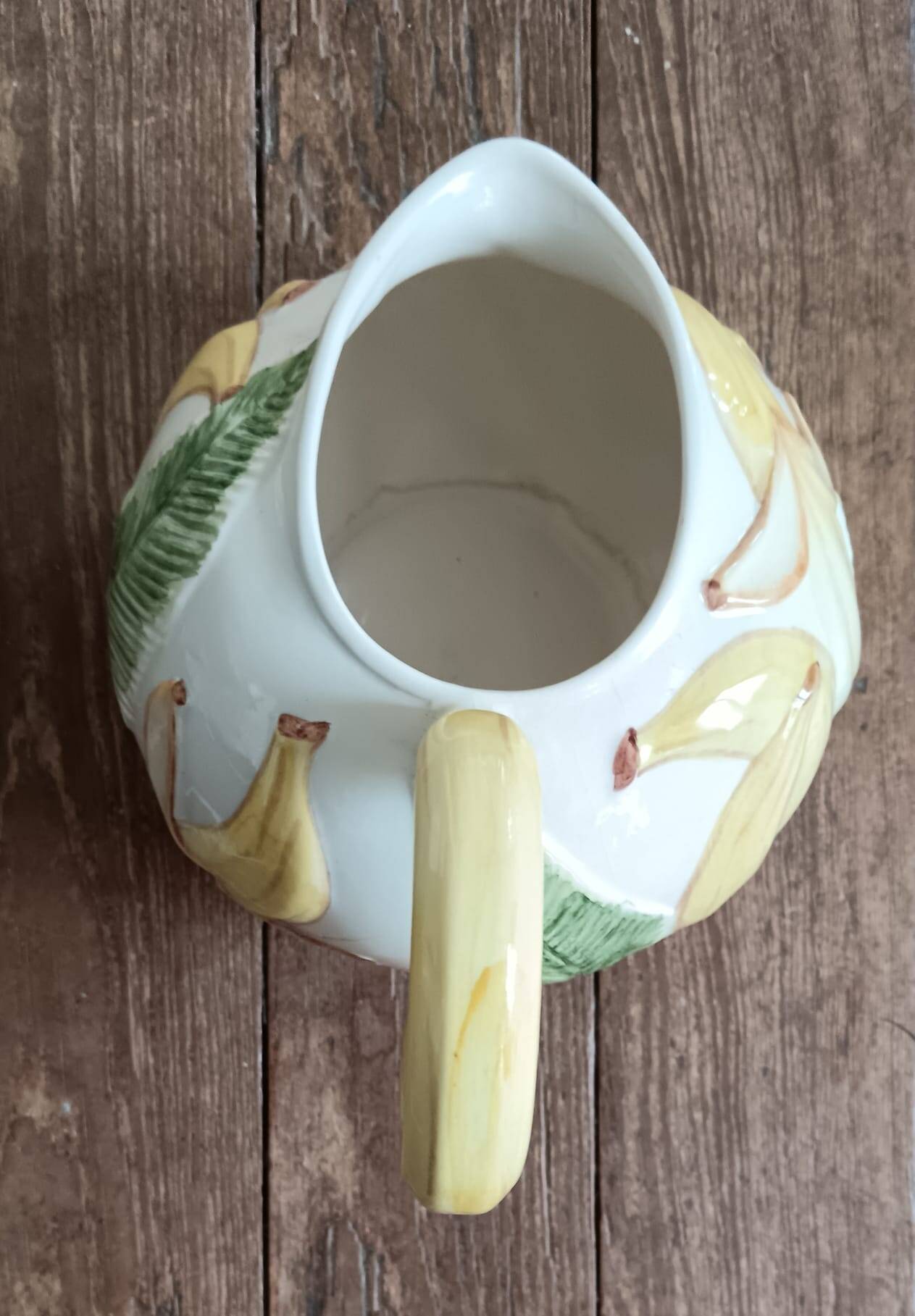Jug in earthenware with banana decoration.