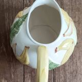 Jug in earthenware with banana decoration.