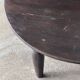 Antique round coffee table in Indonesian teak with turned legs.