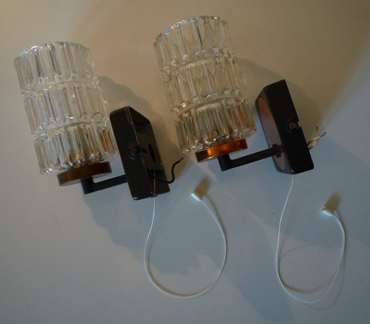 Pair of black lacquered metal, brass and glass wall light