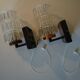 Pair of black lacquered metal, brass and glass wall light