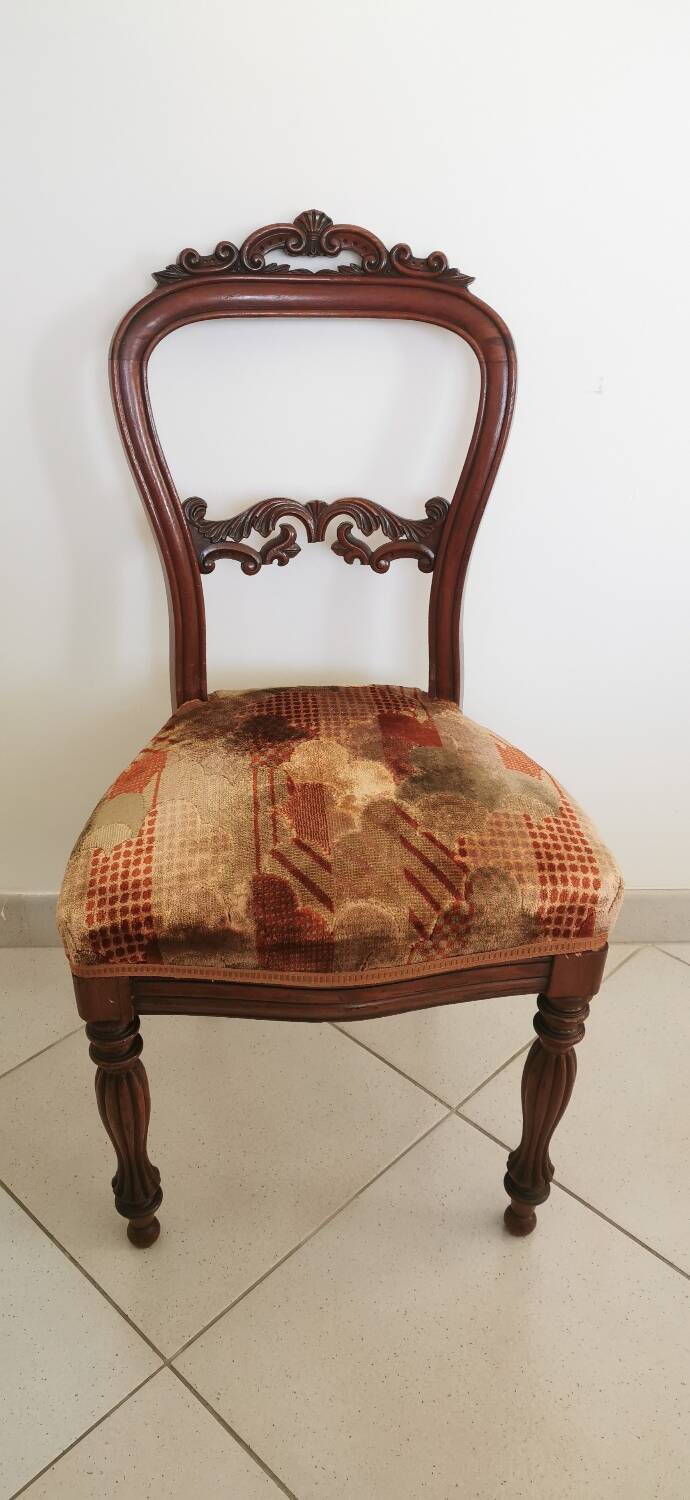 Carved wooden chair and velvet