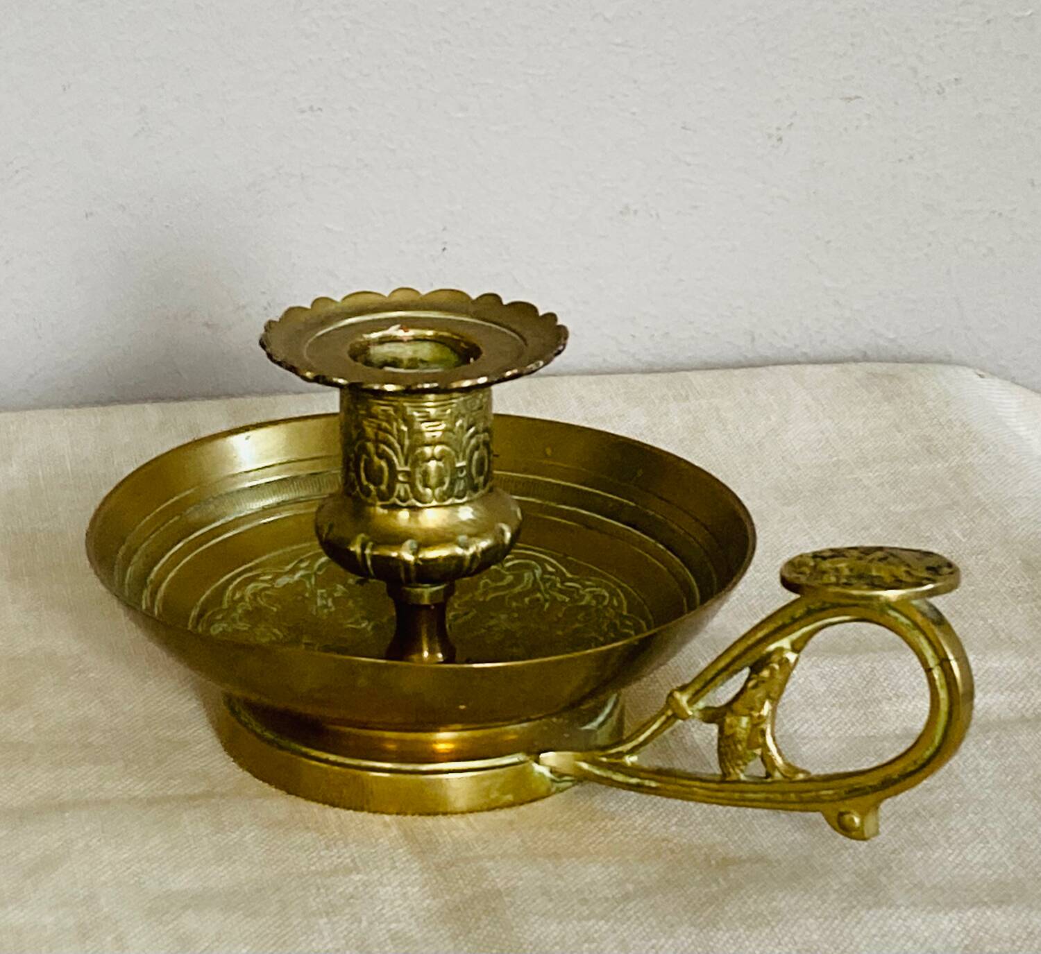 20th century chiseled brass socket candle holder representing Horsemen in armor
