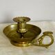 20th century chiseled brass socket candle holder representing Horsemen in armor