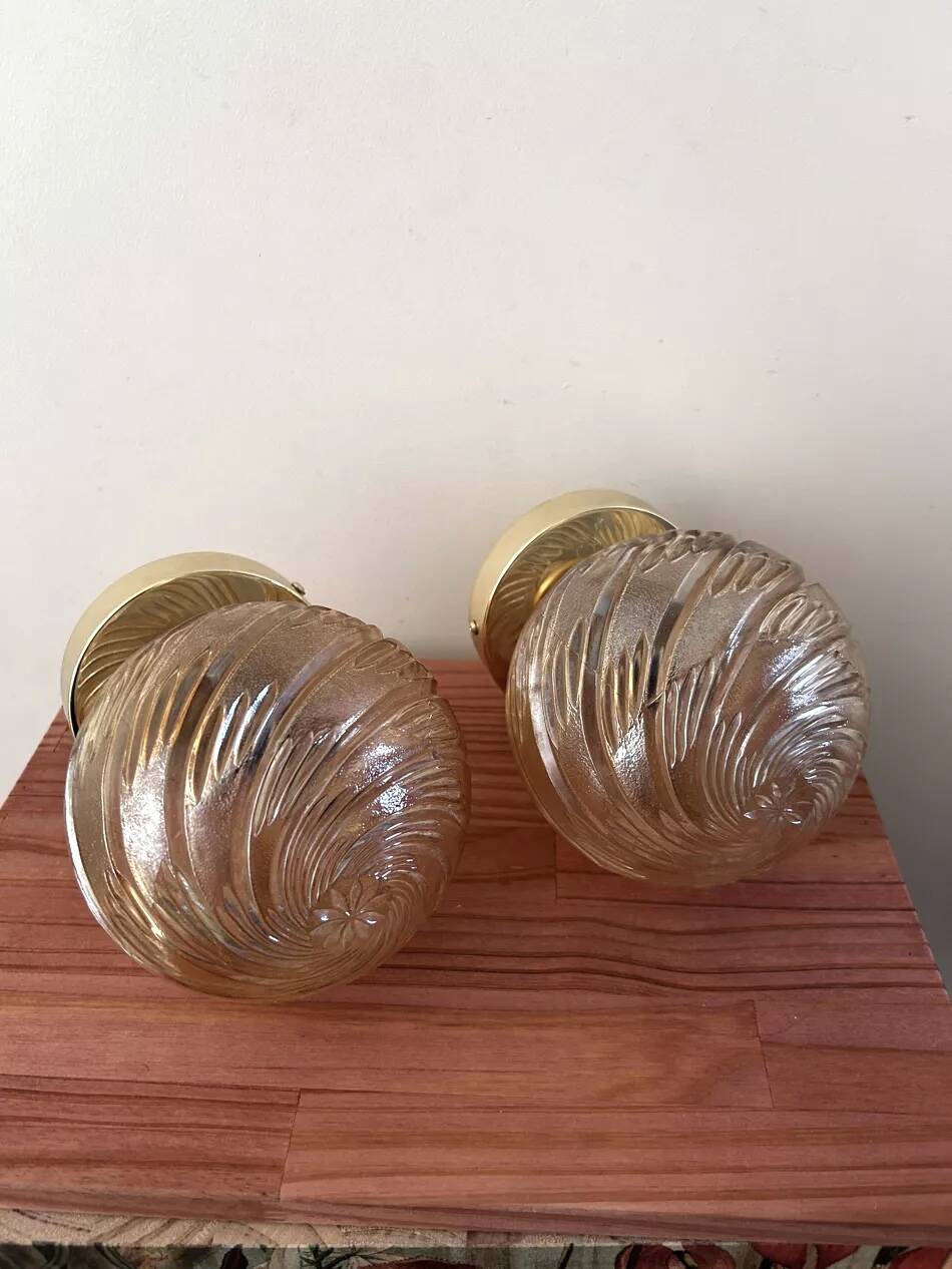 Pair of golden globe wall lights