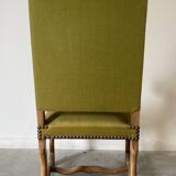 Olive green upholstered armchairs with studs