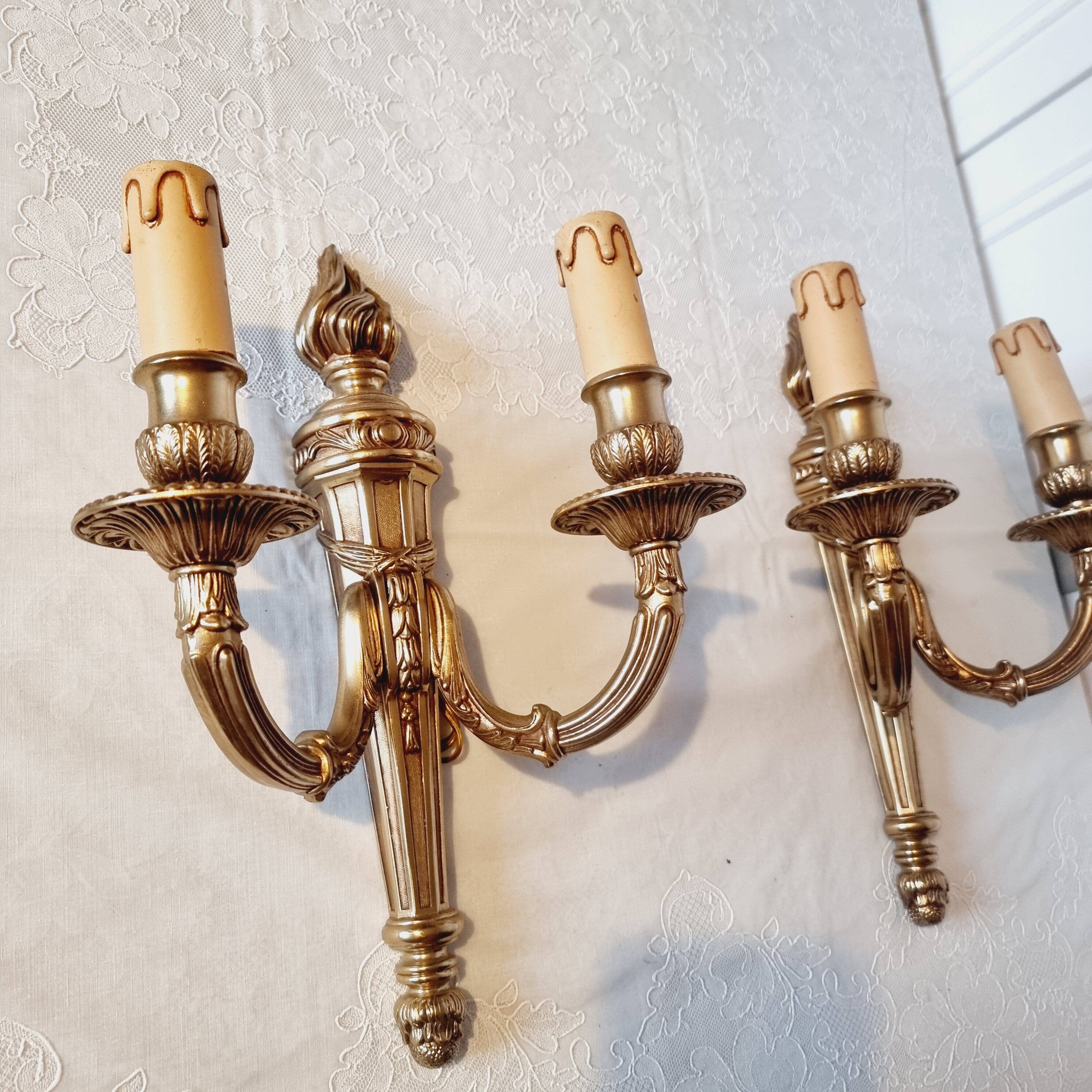 Pair of Louis XV style rocaille two-armed sconces in gilded bronze