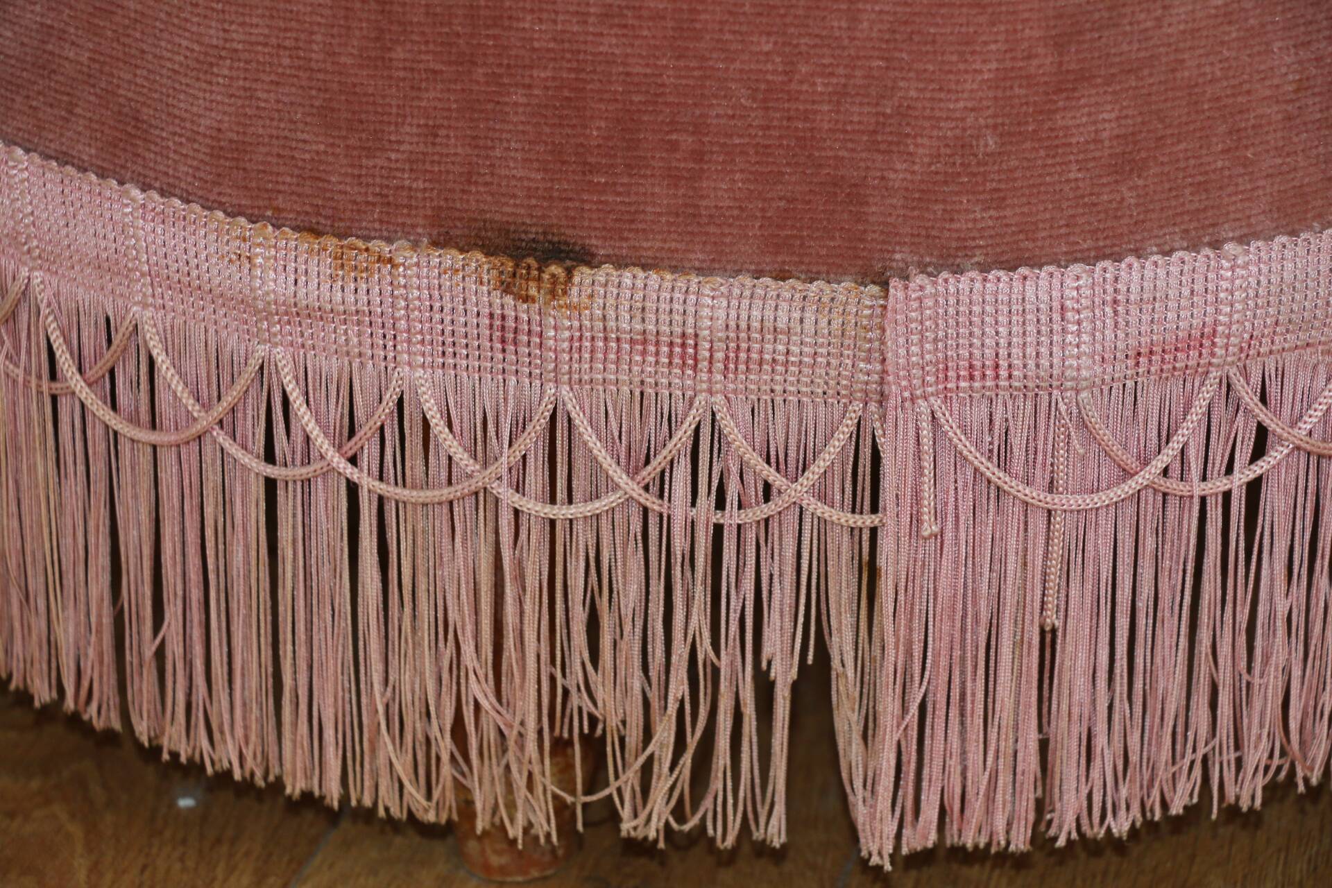 Powder pink fireside chair with fringes
