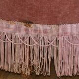 Powder pink fireside chair with fringes