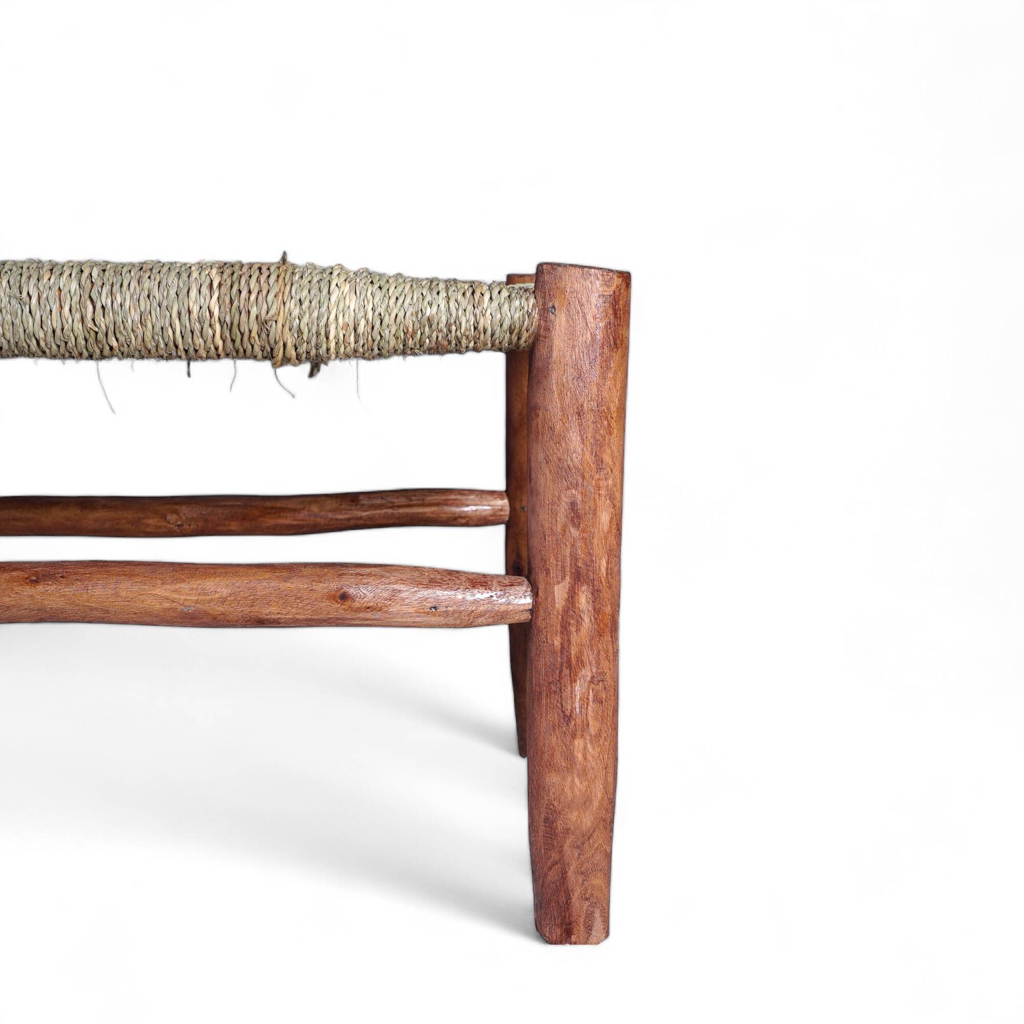 Wooden bench and woven rope