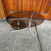 Coffee oval table with metal legs and smoky glass top, 1990s