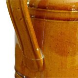 Pichet ancien en faïence française à glaçure orange