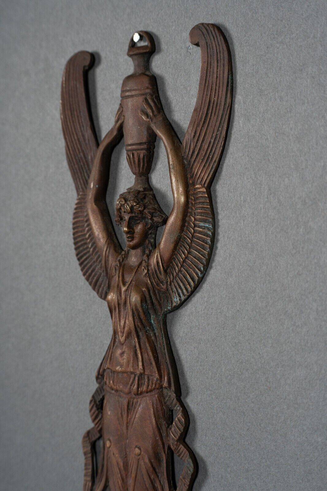 Pair of Empire period bronze sconces decorated with a winged woman