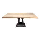 Industrial table with oak top and cast iron central leg