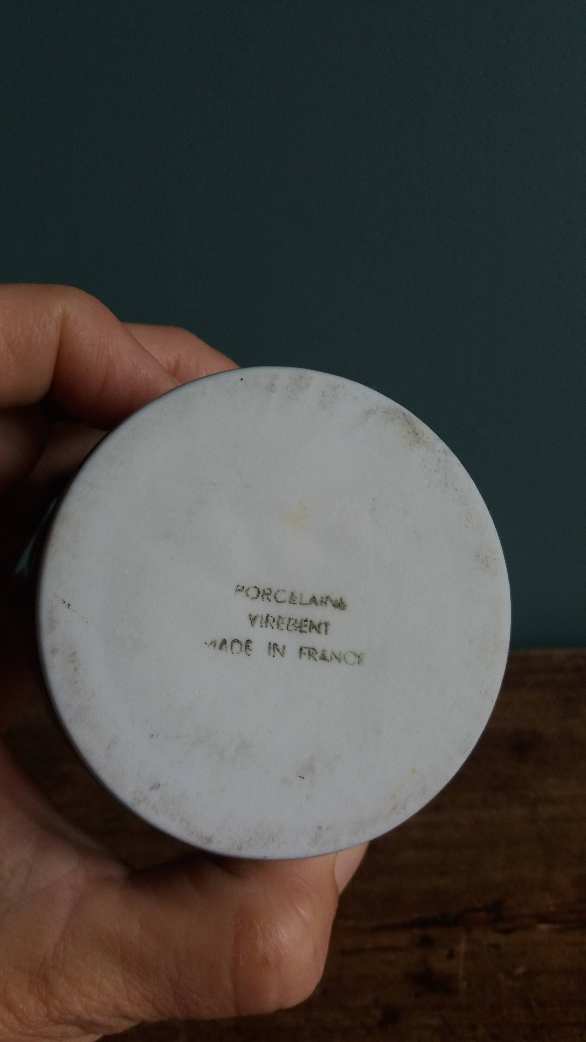 Vase Virebent porcelain cylindrical roll shape with a deep neck.