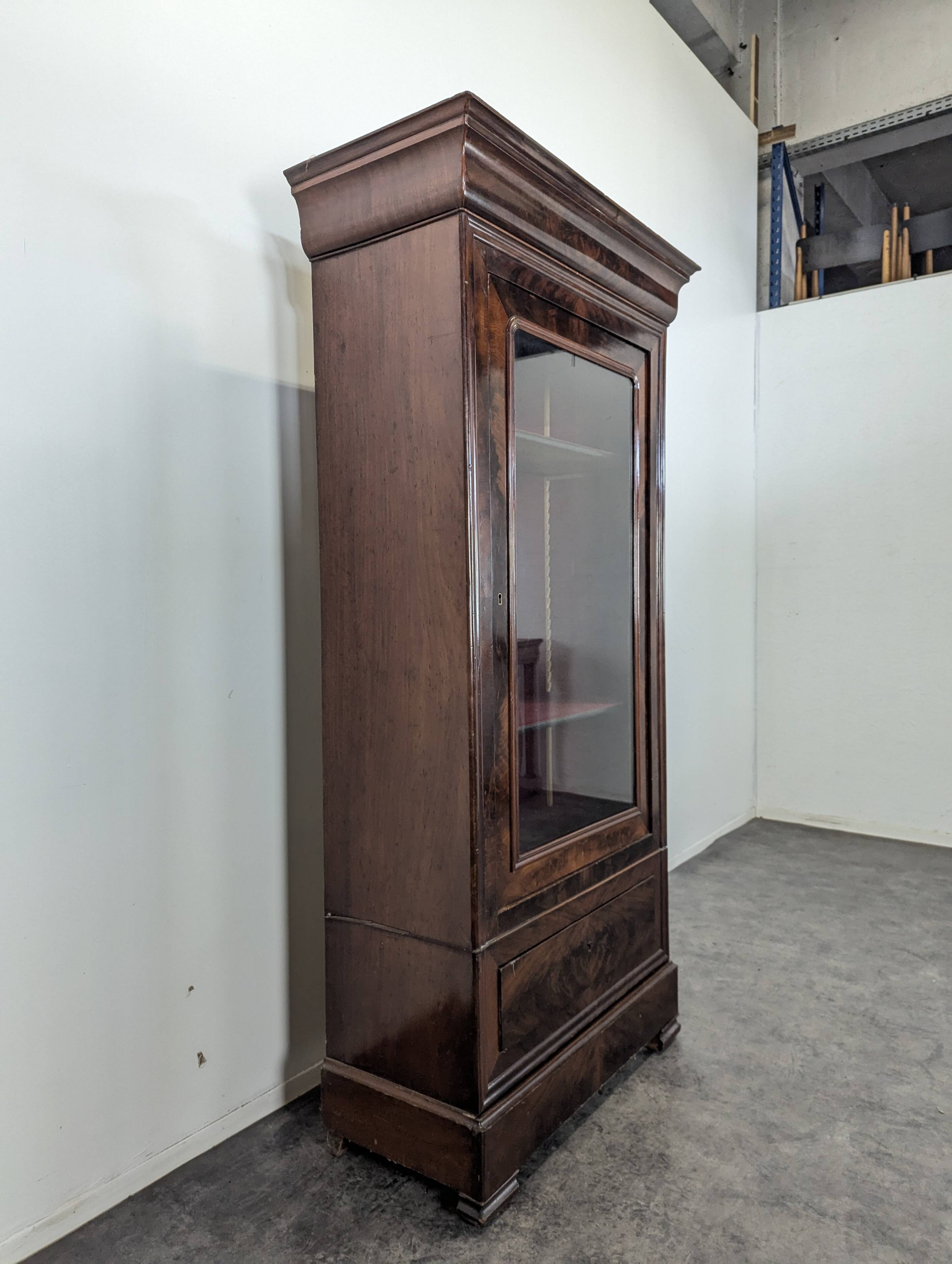 Louis Philippe period glass cabinet in flamed mahogany