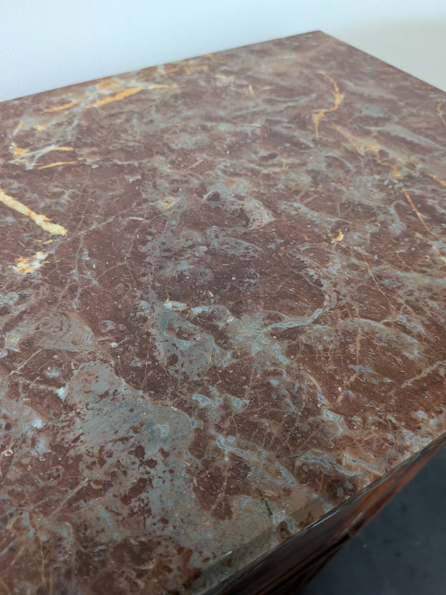 Secretary with a drop-leaf in Louis XVI style made of mahogany and royal red marble.