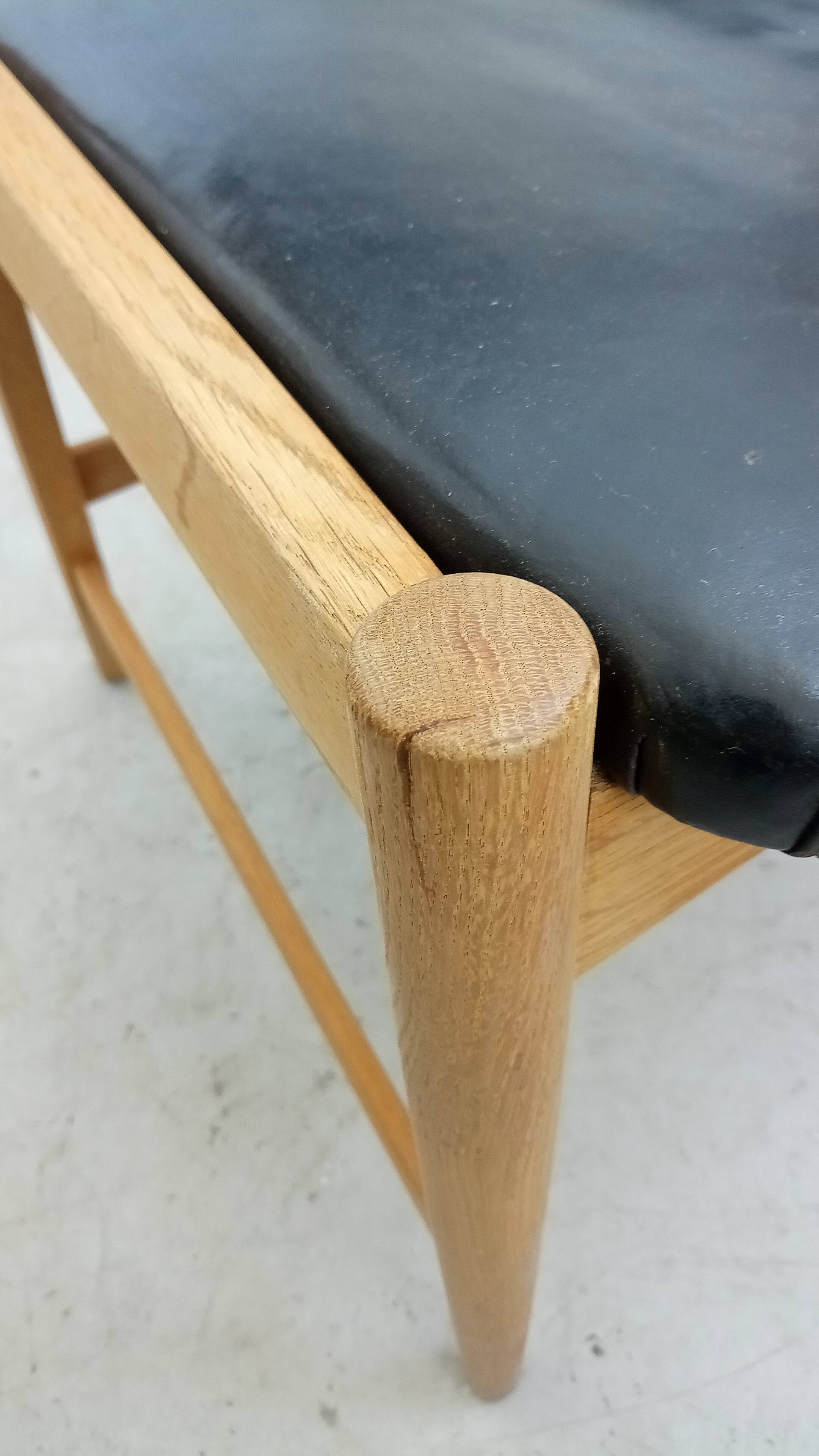 Danish armchair in oak and black leather
