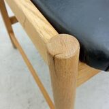 Danish armchair in oak and black leather