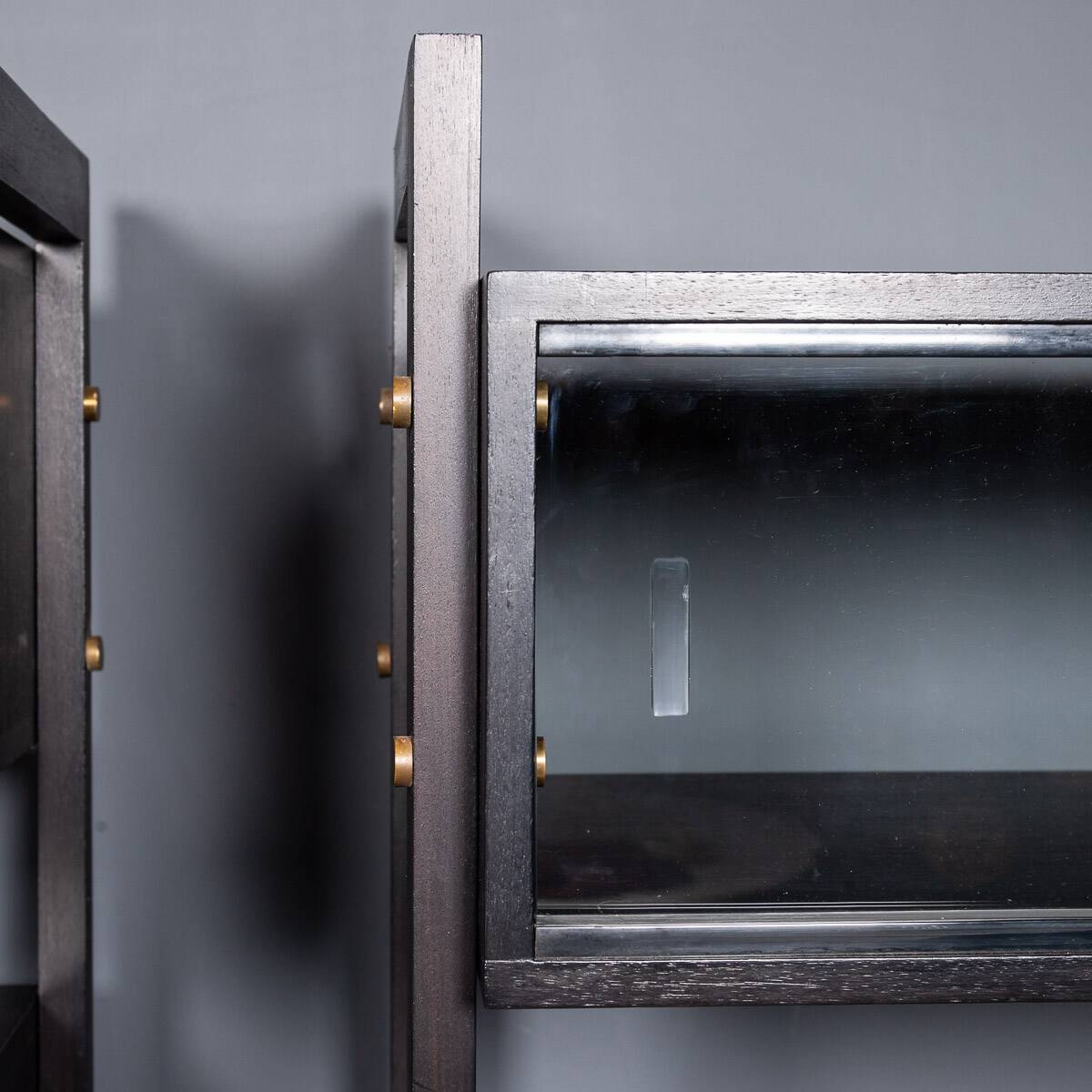 Striking 20thc italian ebonised etageres with open back & storage c.1970