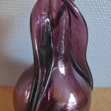 Purple decanter made of blown glass