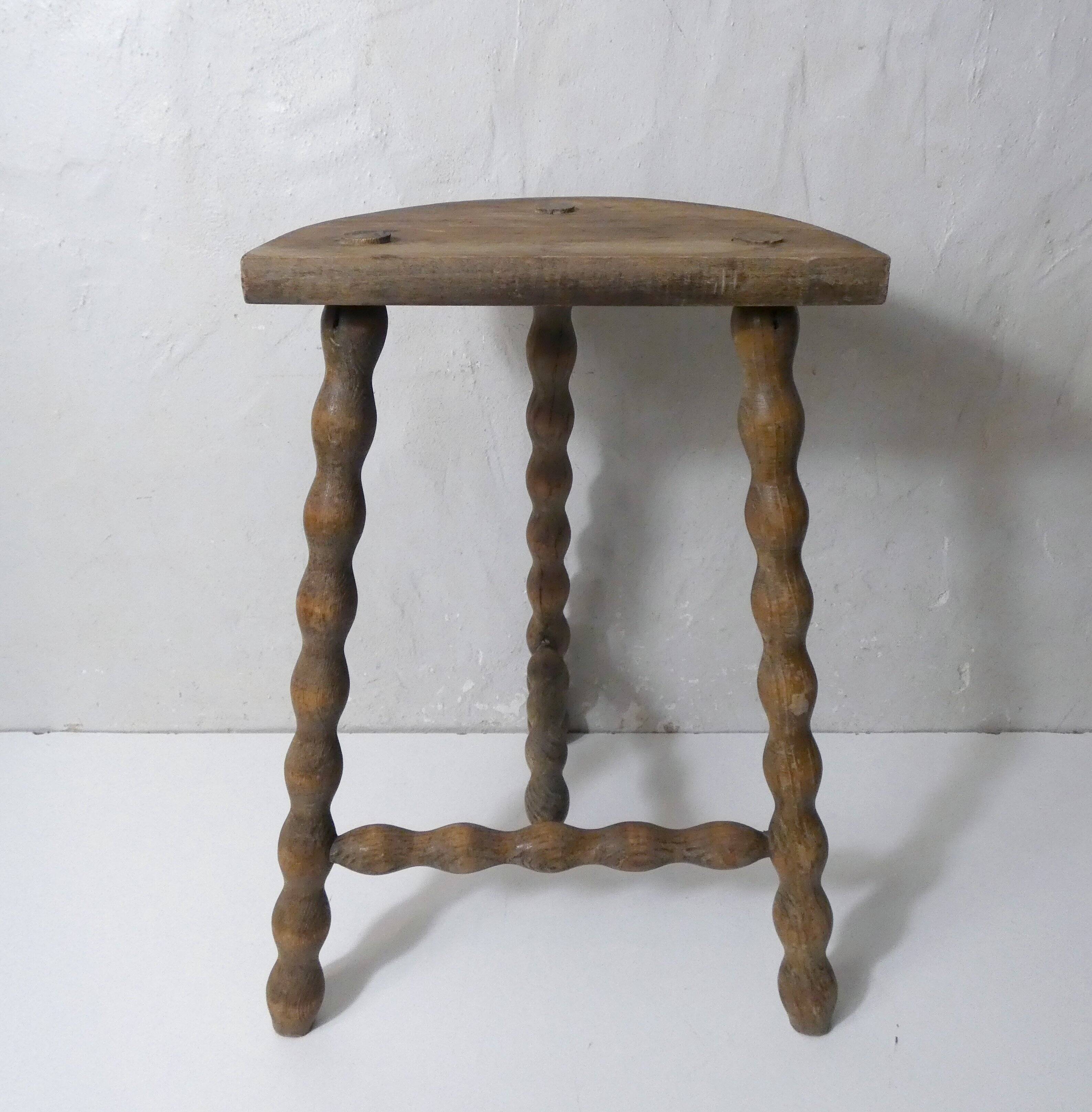 vintage half-moon tripod stool in turned solid wood with beaded edges