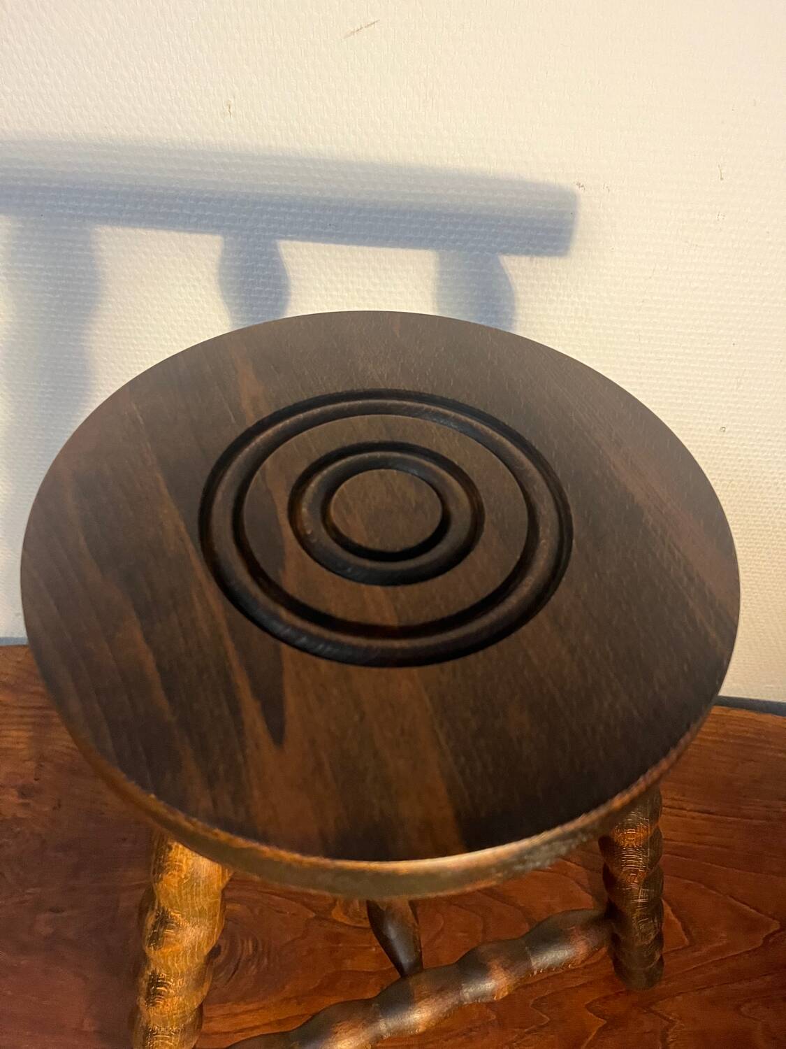 Round tripod stool with turned wooden legs