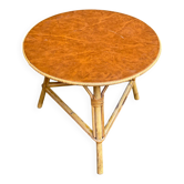 Vintage round coffee table in leather, rattan, and bamboo.