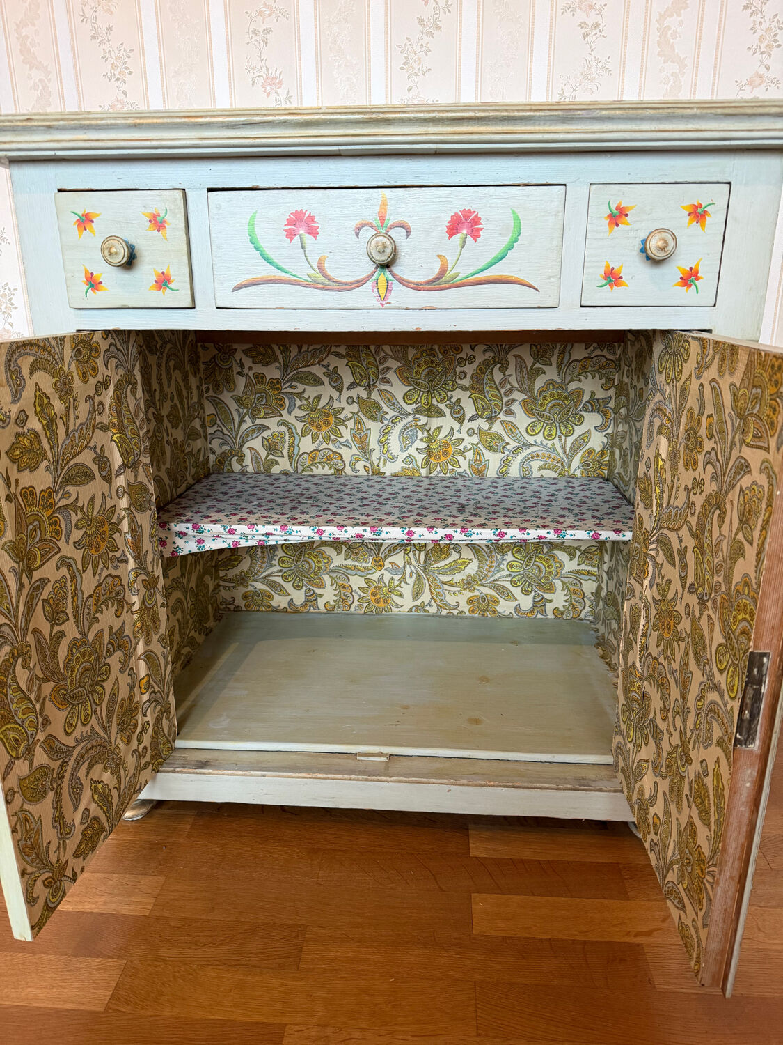 Antique low polychrome sideboard with floral decoration.
