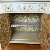 Antique low polychrome sideboard with floral decoration.