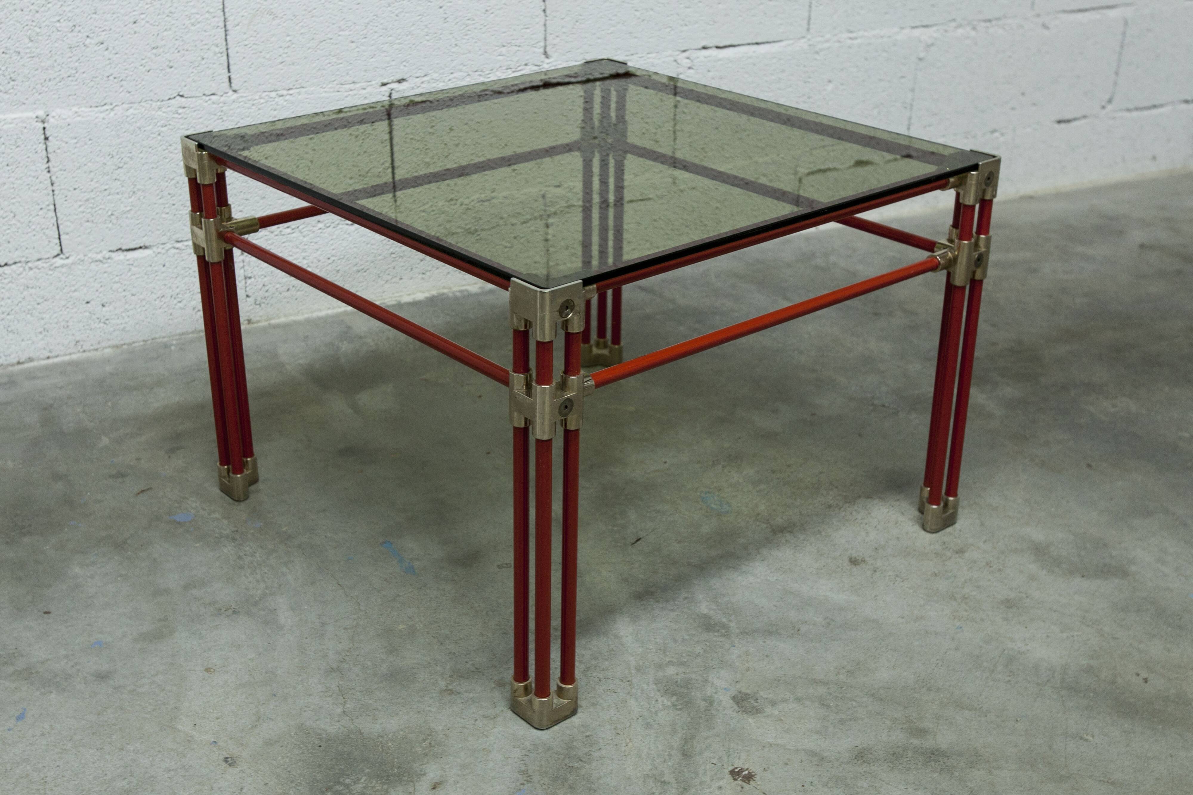 Postmodern Italian design coffee table in smoked glass with red steel structure