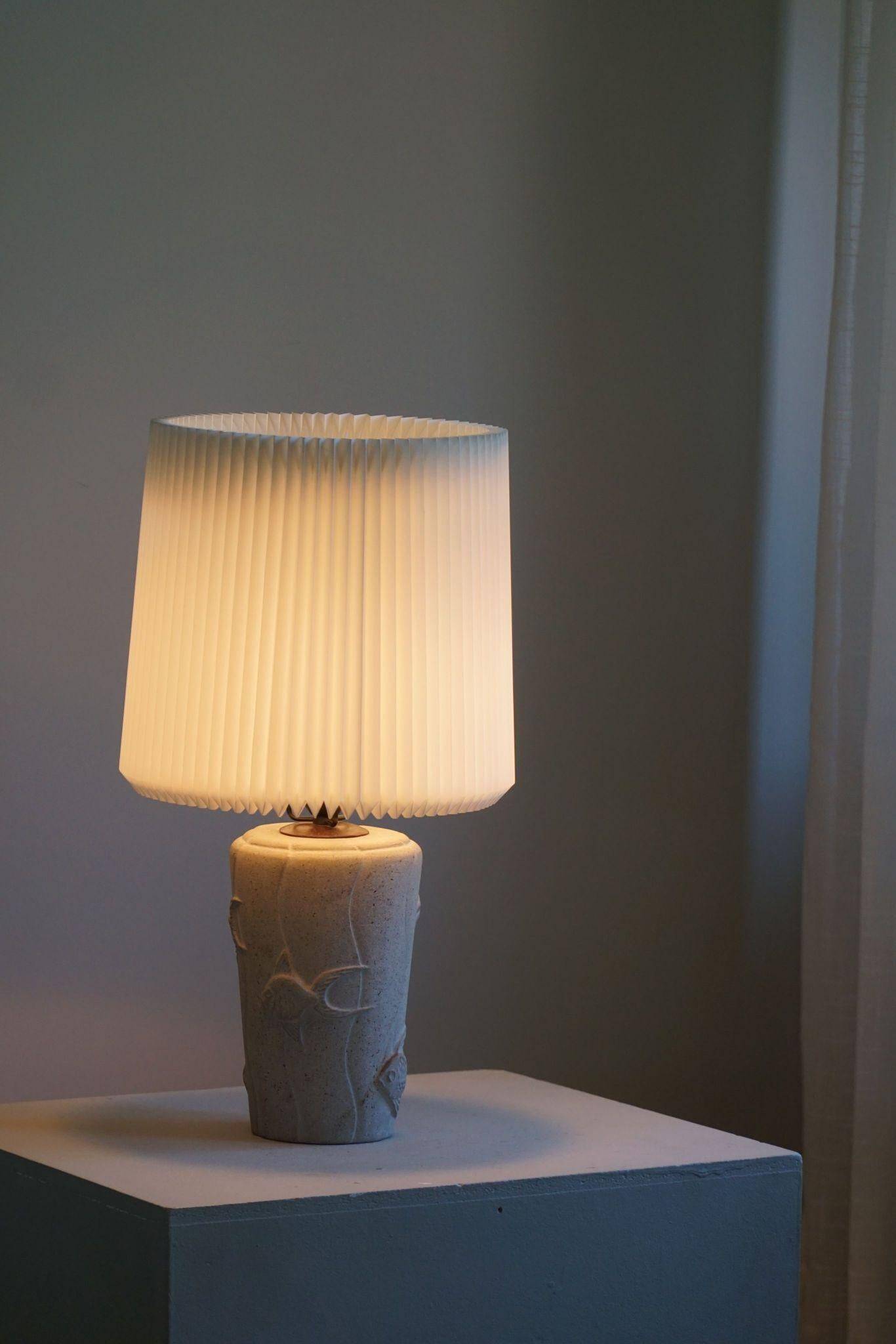 Modern vintage French table lamp, made of stone with fish patterns, 1970s.