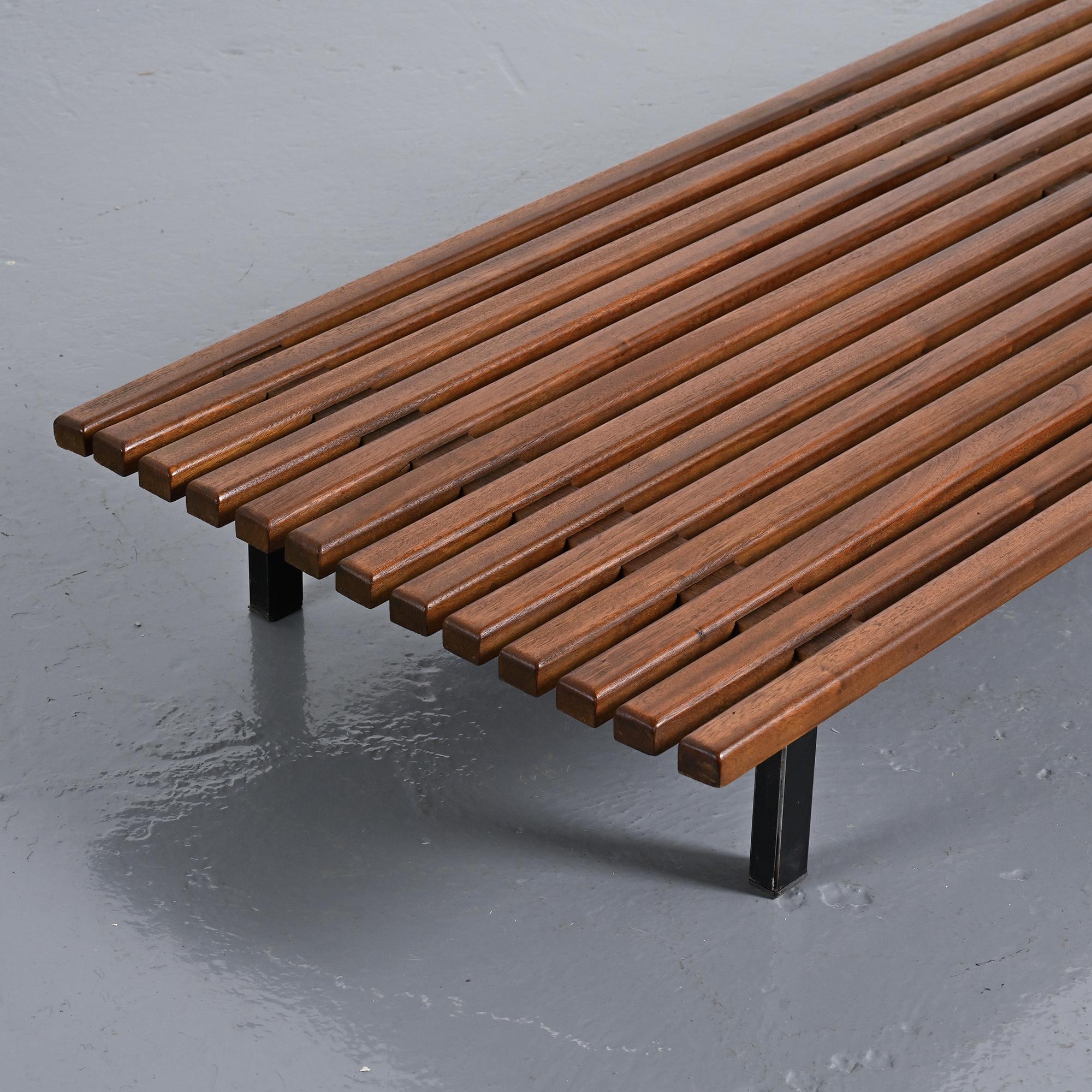 Cansado bench in mahogany by Charlotte Perriand, circa 1962.