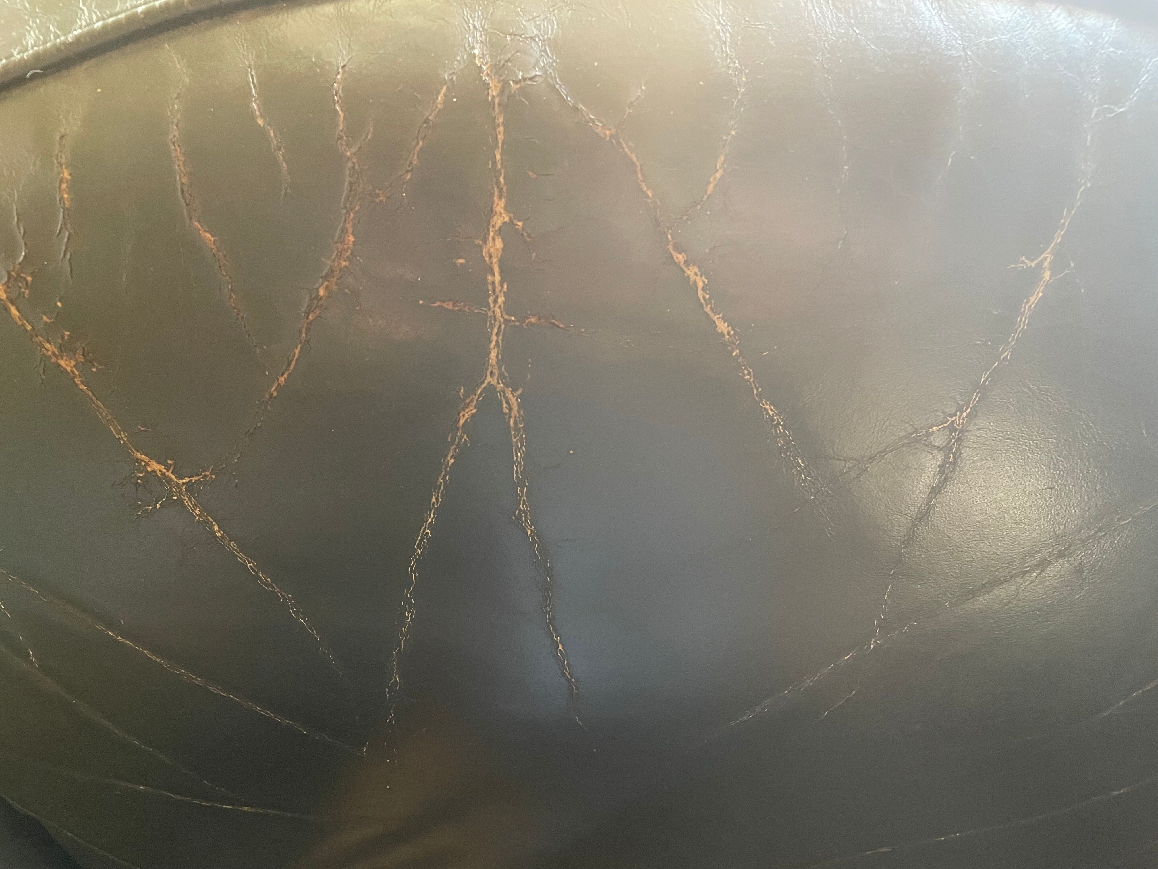 Green leather club chairs