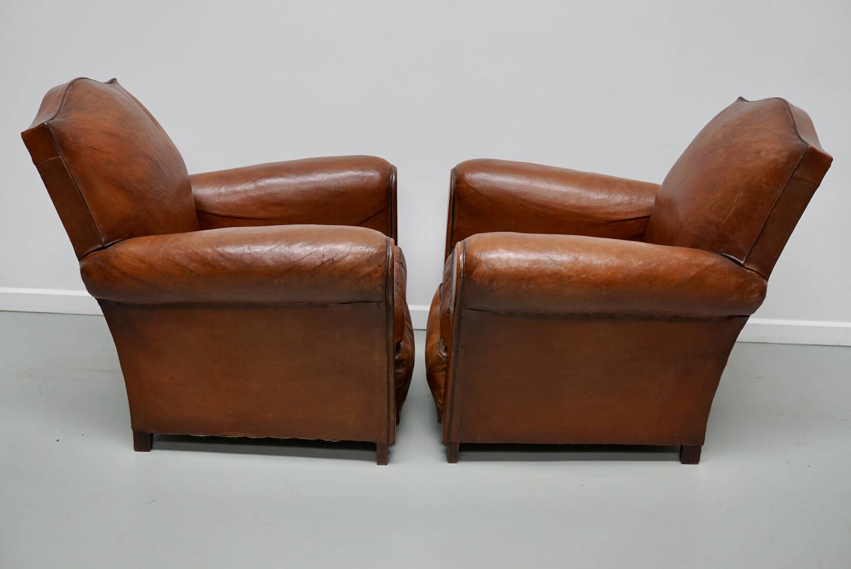 Pair of French Cognac Moustache Back Leather Club Chairs, 1940s